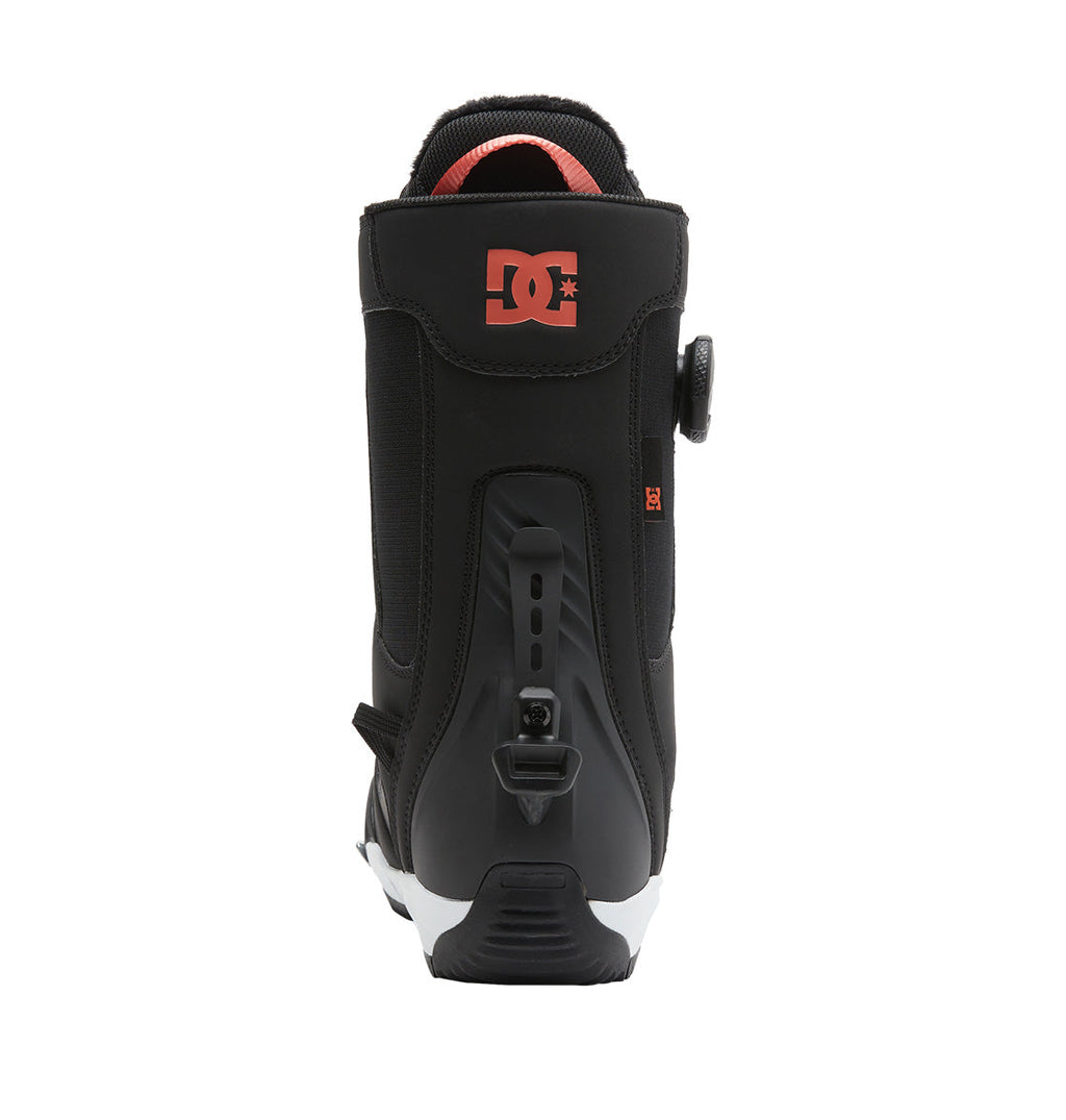 Rear view of the DC Shoes Women’s Phase BOA® Pro Step On® Snowboard Boot in black, featuring a red logo on the upper back and a Dual Zone BOA® Fit System. The sole is primarily black with white accents.