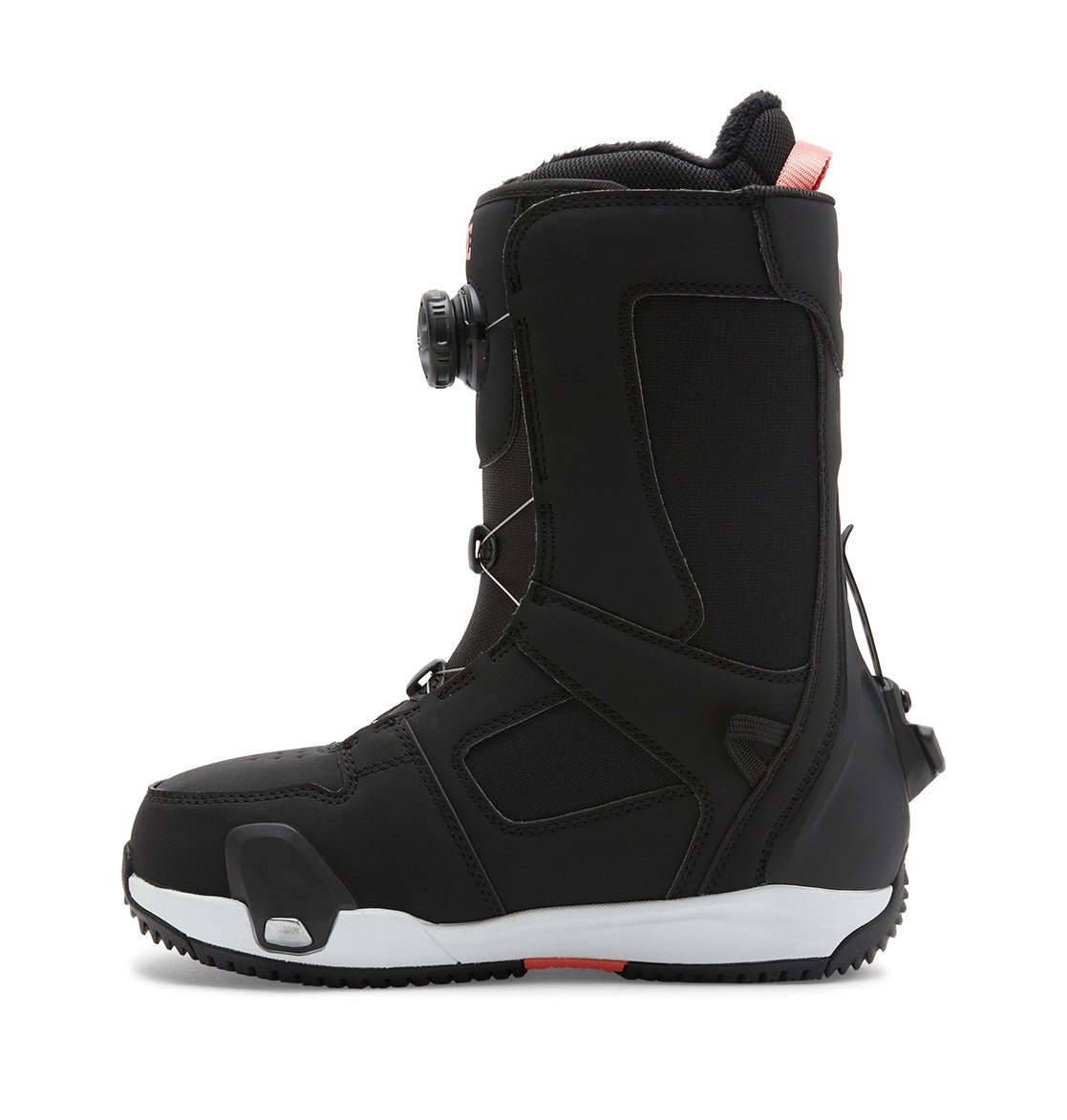 A left-side view of the DC Shoes Women’s Phase BOA® Pro Step On® Snowboard Boot features a black design with a thick white sole, black laces, and a Dual Zone BOA® Fit System dial on the side. Red accents appear near the top and heel.