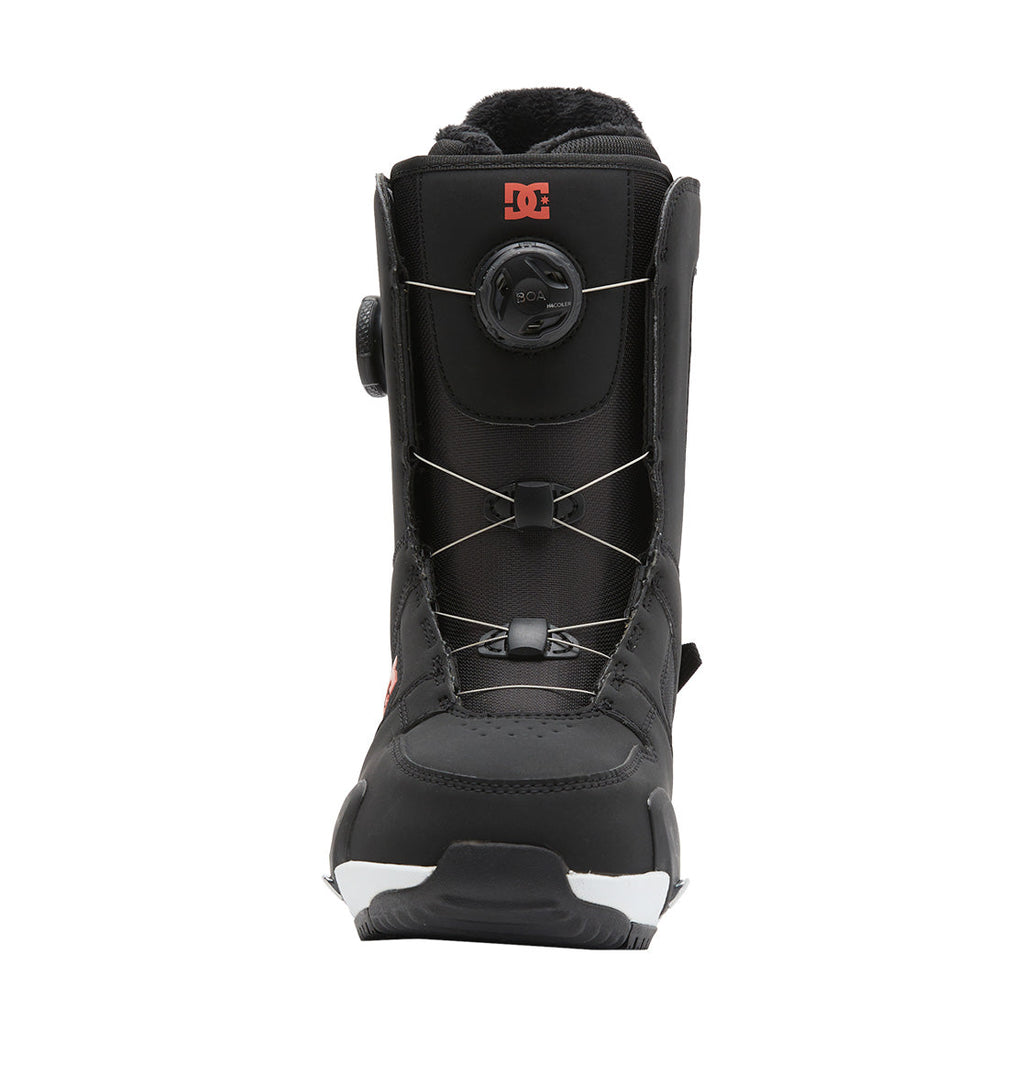 Front view of the DC Shoes Women’s Phase BOA® Pro Step On® Snowboard Boot in black, showcasing the Dual Zone BOA® Fit System with a round dial lacing mechanism, silver lace wires, and a red DC Shoes logo near the top. The black sole features white accents, highlighting the boot’s advanced design.