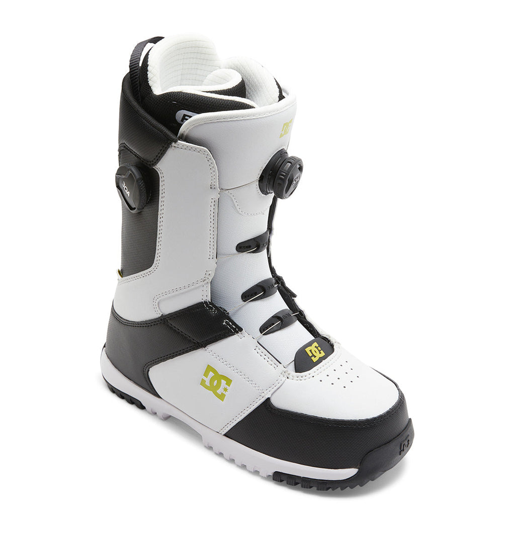 The DC Shoes Men’s Control BOA® Snowboard Boot is a black and white all-mountain boot featuring the Dual Zone BOA® Fit System and a yellow DC logo, shown angled on a white background—blending signature skate-inspired style with advanced performance features.