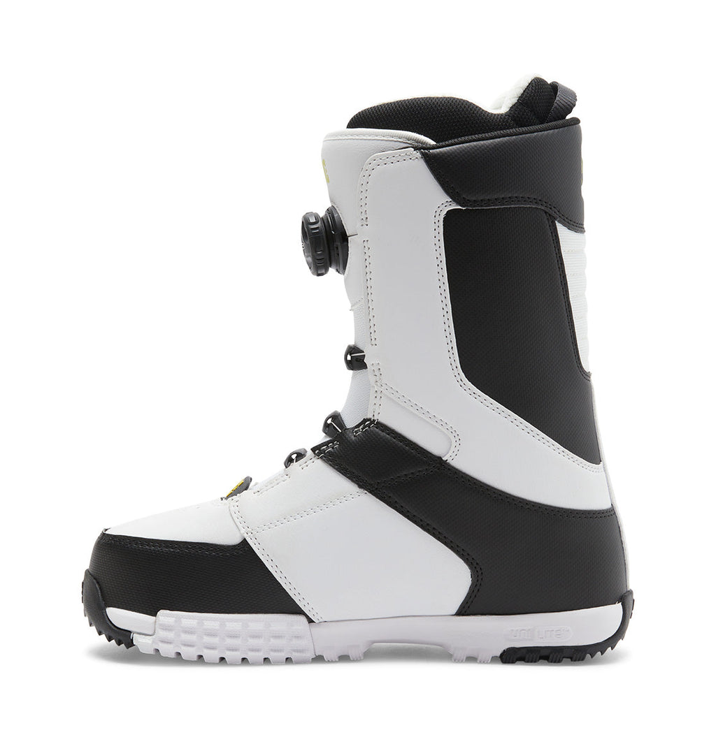 A side view of the DC Shoes Men’s Control BOA® Snowboard Boots, featuring a white and black all-mountain design with a textured sole, high ankle support, and a Dual Zone BOA® Fit System dial closure, set against a plain white background.