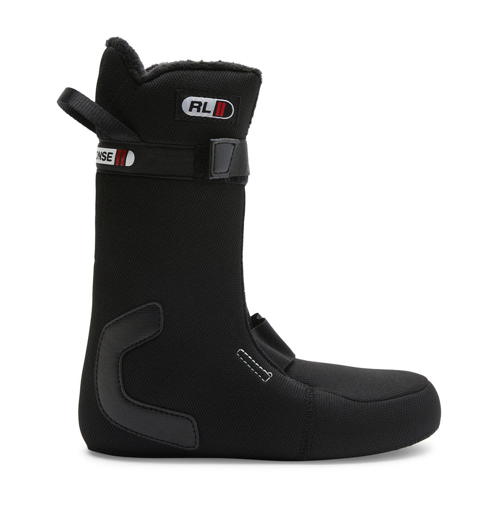 The Women’s Lotus BOA® Snowboard Boot liner by DC Shoes is black with reinforced zones, a pull tab at the top rear, a Velcro strap near the top, and a minimalist logo patch on the side. Featuring an advanced R2 liner for enhanced comfort and support, it stands upright on a white background.