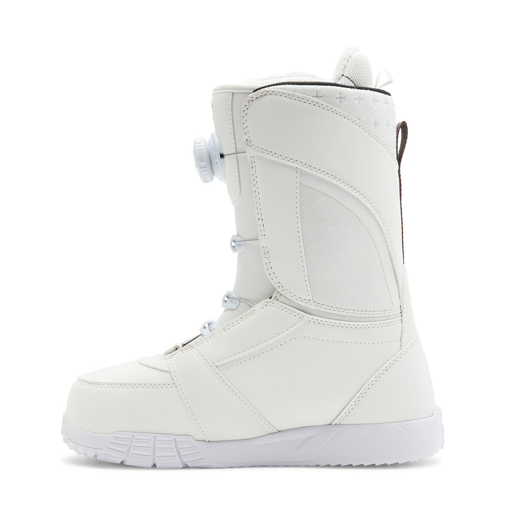 The DC Shoes Women’s Lotus BOA® Snowboard Boots in white, shown from the side, feature a Dual Zone BOA® Fit System lacing, a textured Unilite outsole, and a padded upper for enhanced ankle support.