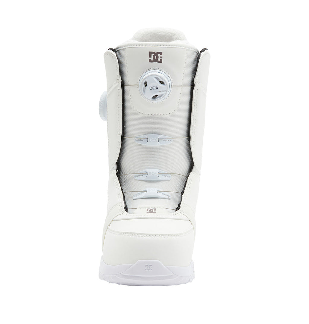 Front view of a single white Women’s Lotus BOA® Snowboard Boot by DC Shoes, featuring the Dual Zone BOA® Fit System and DC logo on the tongue and toe, with a Unilite outsole, isolated on a white background.