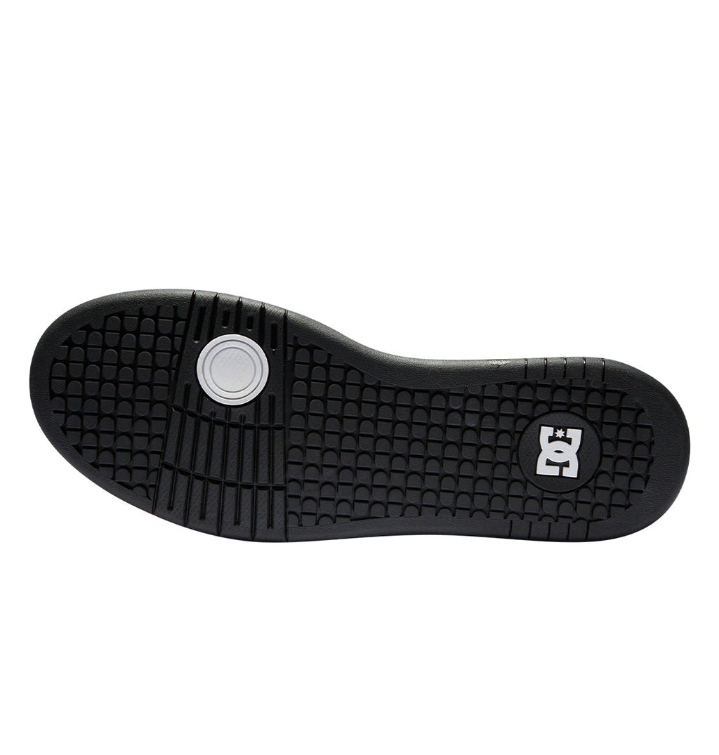 The Men’s Manteca 4 HI Shoes by DC Shoes feature a black sole with a textured, grid-like tread pattern for maximum grip, a circular white accent near the heel, and a white DC Shoes logo on the right side of the forefoot area.