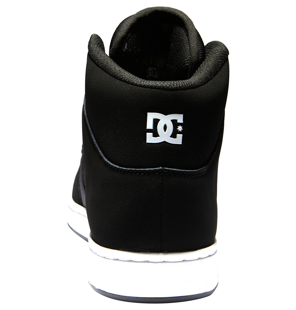 A rear view of the DC Shoes Men’s Manteca 4 HI shows the white DC logo on the heel and a durable black leather upper, complemented by a black and white sole engineered for maximum grip, all set against a plain white background.