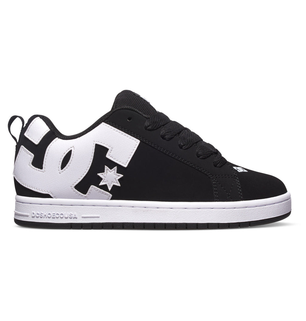 The Men’s Court Graffik Shoes by DC Shoes feature a black and white color scheme with a prominent white DC logo on the side, black laces, and a contrasting white sole. This low-top skate shoe displays the classic puffy silhouette and distinctive branding near the heel and toe.