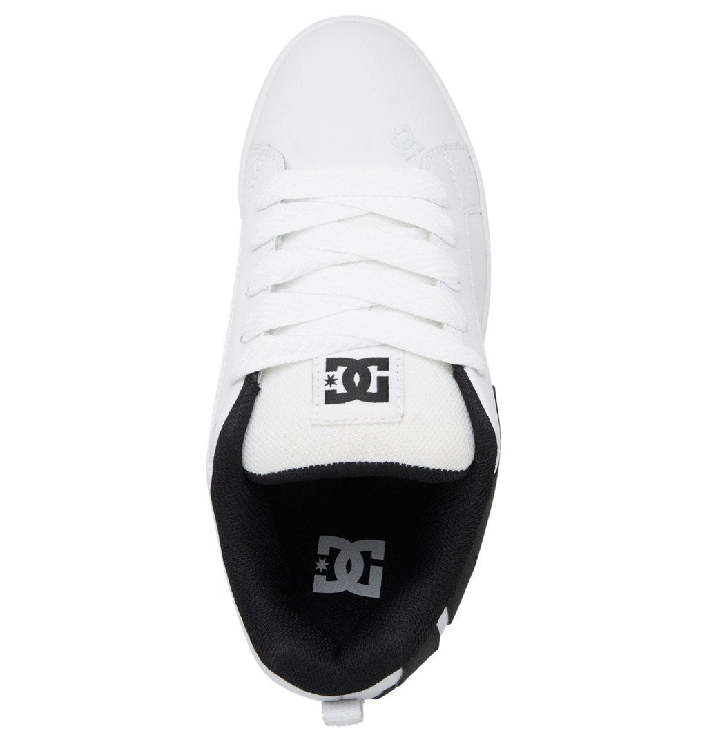 A top view of the Men’s Court Graffik Shoes by DC Shoes reveals a white sneaker with matching white laces and a contrasting black interior, featuring the iconic DC Shoes logo on both the tongue and insole. Known for its puffy silhouette, this model combines comfort with street style for an effortlessly standout look.