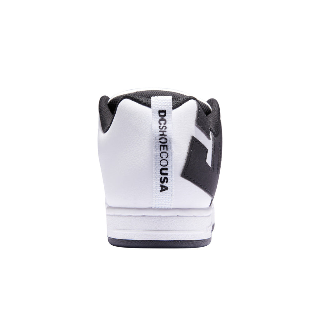 A rear view of the Men’s Court Graffik Shoes by DC Shoes in white and black highlights DCSHOECOUSA printed on the heel’s vertical white strip. The signature DC logo stands out, while the shoe’s puffy silhouette, padded collar, and clean white sole complete the look.