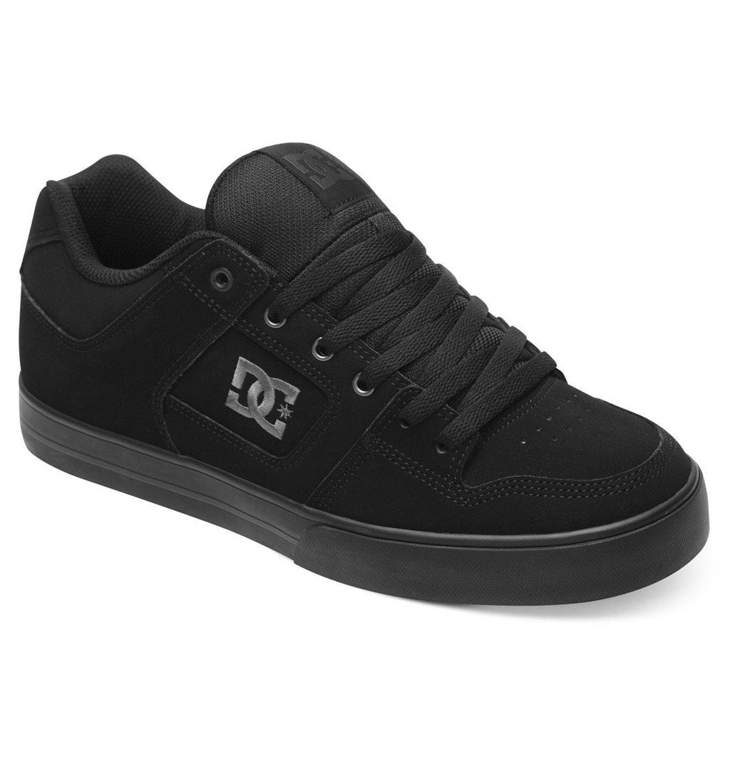 A pair of Men’s Pure Shoes by DC Shoes in black, featuring a low-profile silhouette, thick sole, lace-up closure, and the signature DC logo on the side—these comfortable shoes are ideal for everyday wear.