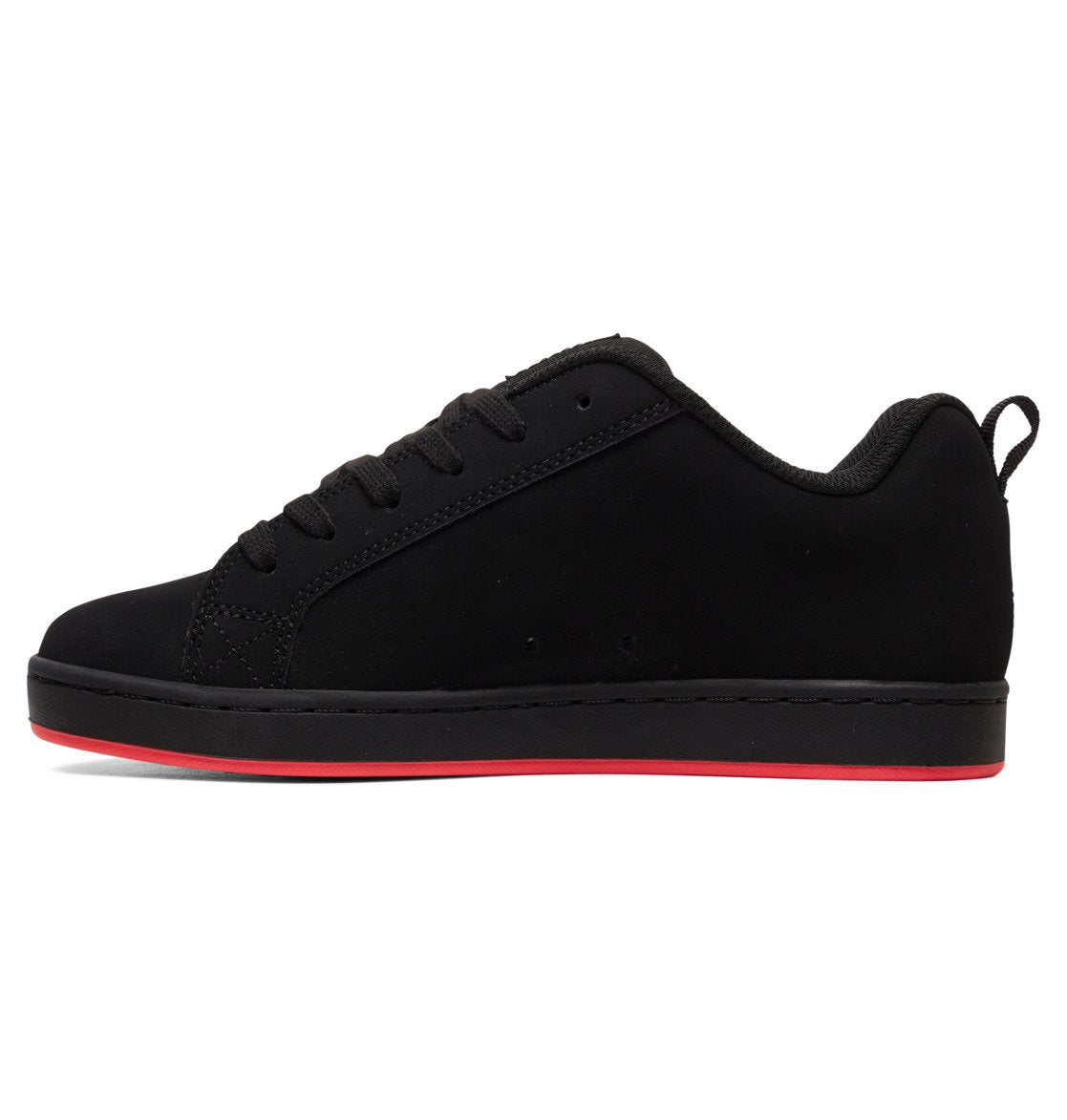 The Women’s Court Graffik Shoes by DC Shoes feature an all-black design with black laces, a black sole, and a slim red stripe along the bottom edge for a signature ’90s-inspired look. This women’s sneaker is displayed from the side against a white background.