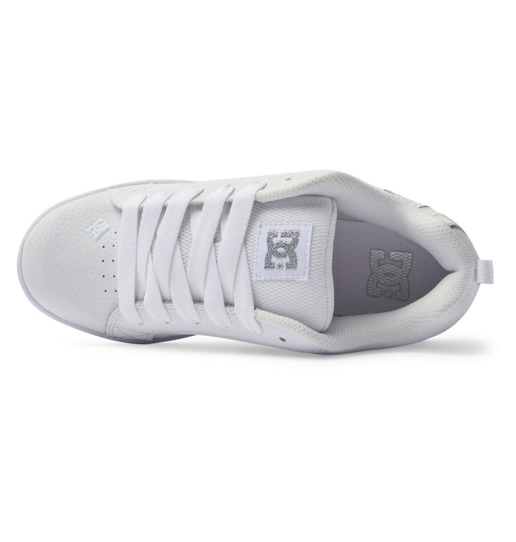 Top view of the DC Shoes Women’s Court Graffik Shoes, featuring wide white laces and a gray DC logo on the tongue and insole. This chunky sneaker boasts a textured surface, visible stitching details, and captures true ‘90s style.