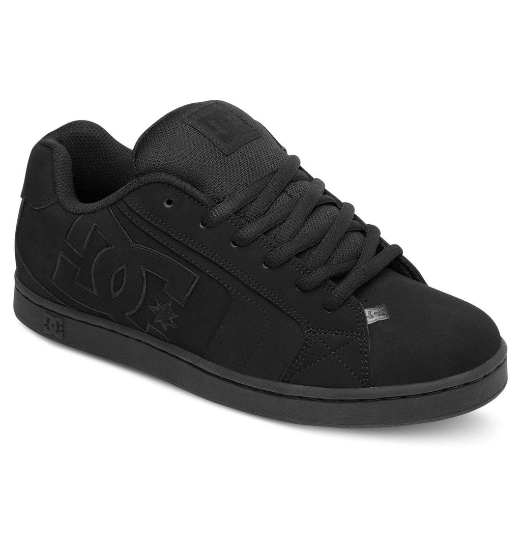 A black low-top DC Shoes Men’s Net Shoe featuring a thick sole, bold DC logo on the outer side, and black laces. This puffy sneaker is shown at an angle highlighting the outer side and front, crafted from durable materials for lasting wear.