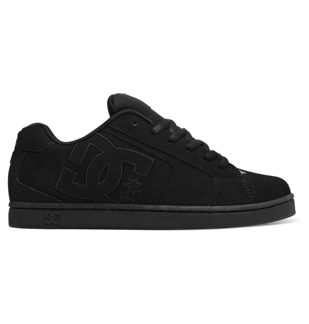 Introducing the Men’s Net Shoes by DC Shoes: a classic puffy sneaker crafted from durable fabrics in all black, featuring black laces, a flat sole, and a prominent embossed DC logo on the side.