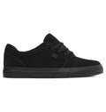 The Men’s Anvil Shoes by DC Shoes feature a black suede, low-top silhouette with black laces and a flat black rubber sole for all-day comfort. Displayed in side profile against a white background, these vulcanized shoes seamlessly merge classic skate-inspired style with everyday versatility.