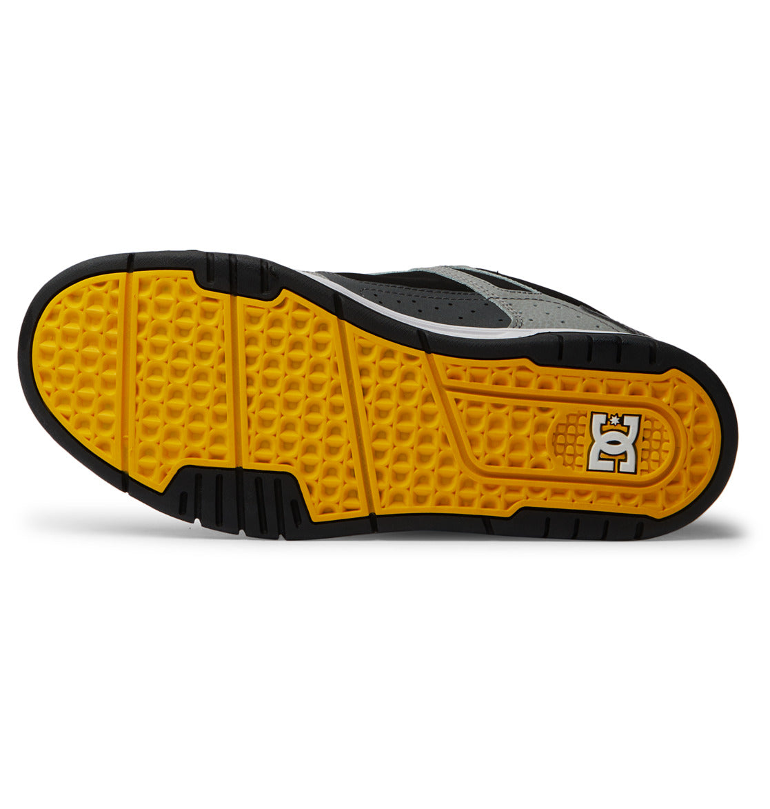 The bottom of the DC Shoes Men’s Stag Shoes features a black and gray design with a yellow textured sole and a white DC Shoes logo on the heel area, highlighting DC Shoes’ classic style with a durable cupsole built for long-lasting wear.