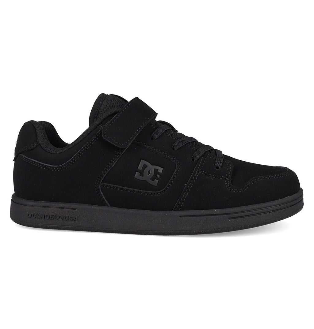 The Kids’ Manteca 4 V Shoes by DC Shoes feature a black suede upper with durable construction, a Velcro strap, laces, and the signature DC logo on the side. Displayed in a side profile against a white background, these sneakers offer kid-friendly style and long-lasting wear.