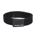 The DC Stash Web Belt by DC Shoes is a black fabric belt with a rectangular black buckle that has “DCSHOECOUSA” printed in white on the front, and it features an adjustable web design for a comfortable fit.