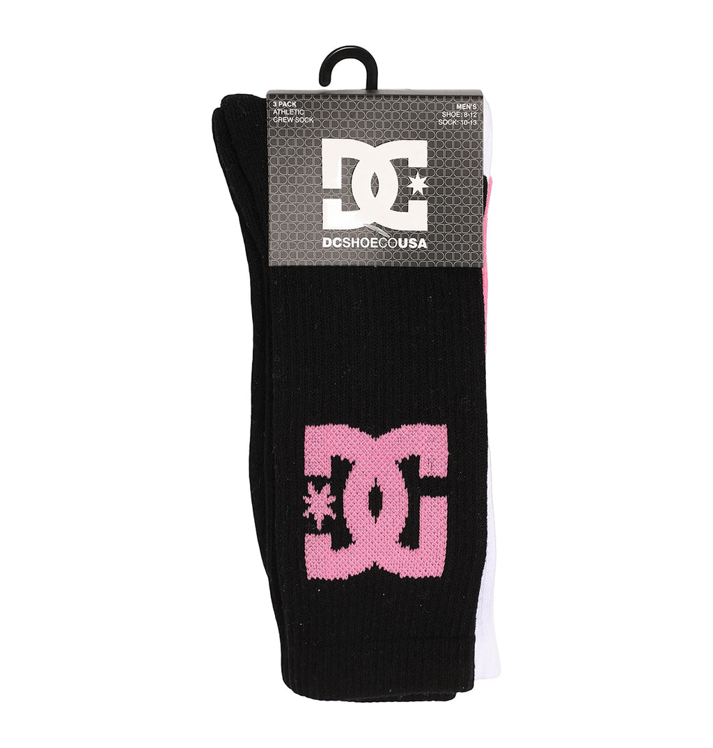 The DC Shoes Big Star Logo Crew Socks 3-Pack features black and white socks with a pink DC logo on the visible black sock, attached to a cardboard label displaying the DC Shoes USA logo.