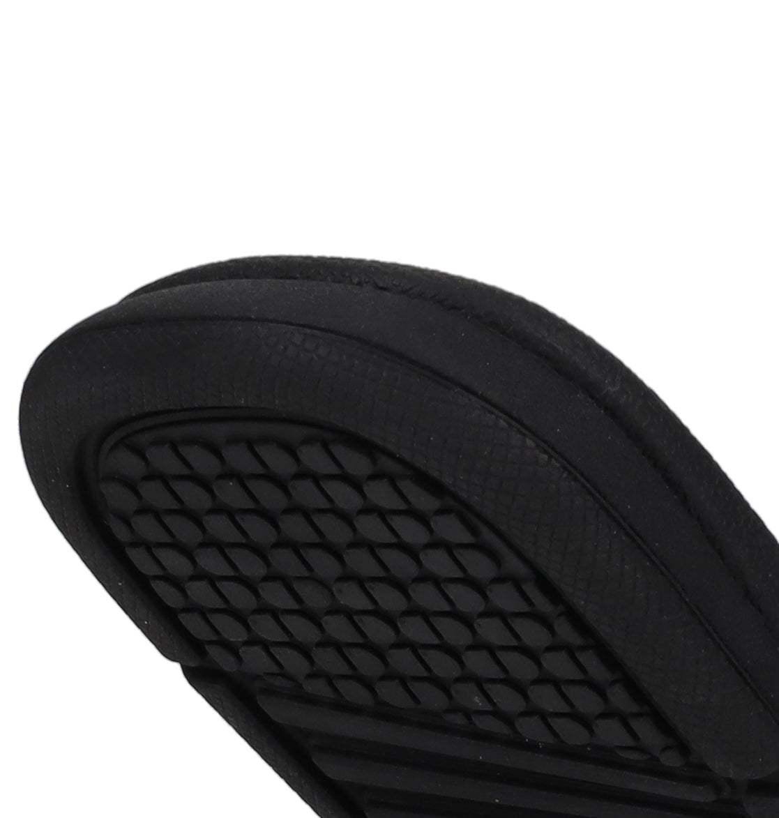Close-up of the sole on DC Shoes Kids' Bolsa Slides, featuring a black diamond-patterned grip—offering secure comfort and standout style.