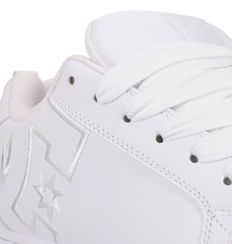 Close-up of the DC Shoes Men’s Court Graffik, a special edition sneaker featuring white laces, silver stitching, and a partially visible star logo on the side. The shoe showcases a clean, smooth leather texture inspired by classic Court Graffik designs.