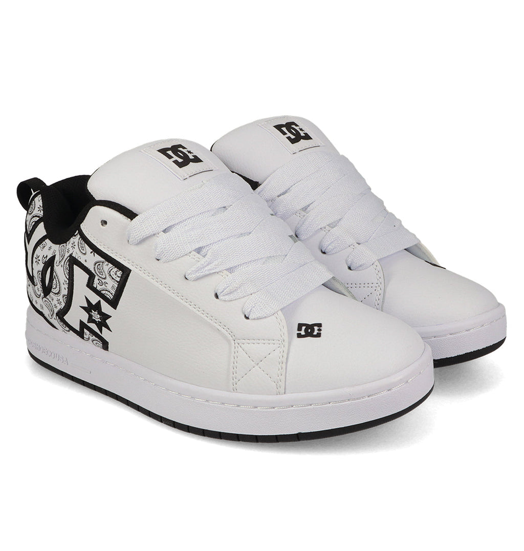 A pair of DC Shoes Men's Court Graffik Shoes in white, featuring a puffy silhouette, thick white laces, black inner lining, bold DC logo, black-and-white side graphics, and white soles with contrasting black outsoles.