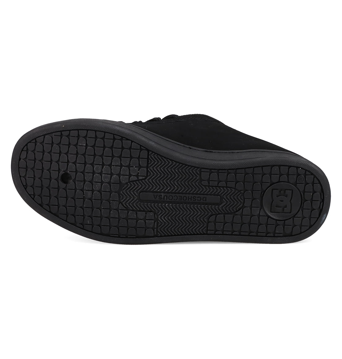 The sole of a black Women's Court Graffik Shoe by DC Shoes features a textured grid pattern for grip, with the DC logo and DCSHOECOUSA embossed in the center.