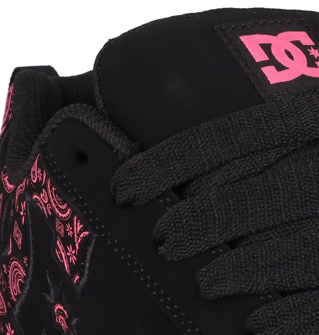 Close-up of DC Shoes' Women's Court Graffik sneaker in black with black laces, pink paisley print, and the DC logo on tongue and side, all in the classic puffy silhouette.