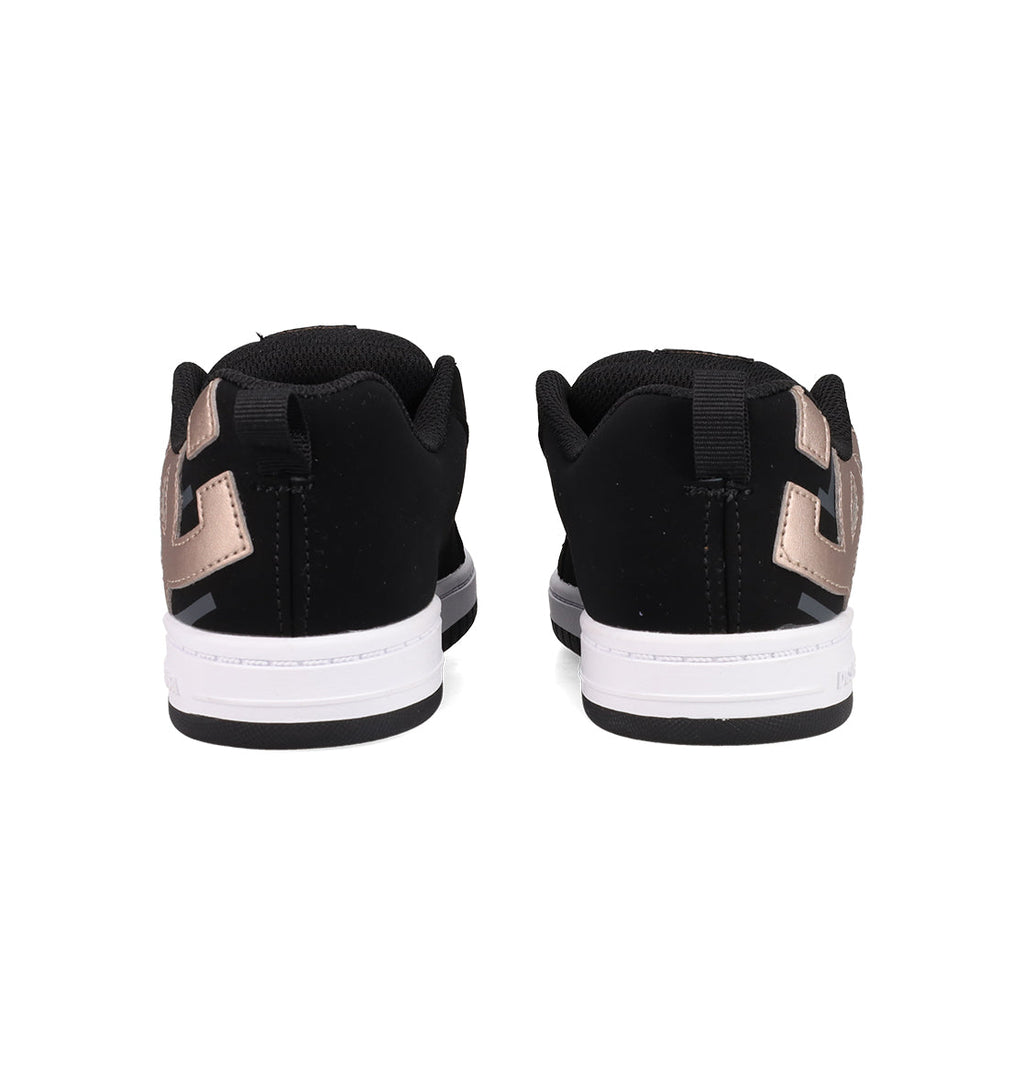 The Kids’ Court Graffik Shoes by DC Shoes are shown from the back in black and white with metallic accents, highlighting their classic puffy silhouette and detailed heel and sole against a white background.