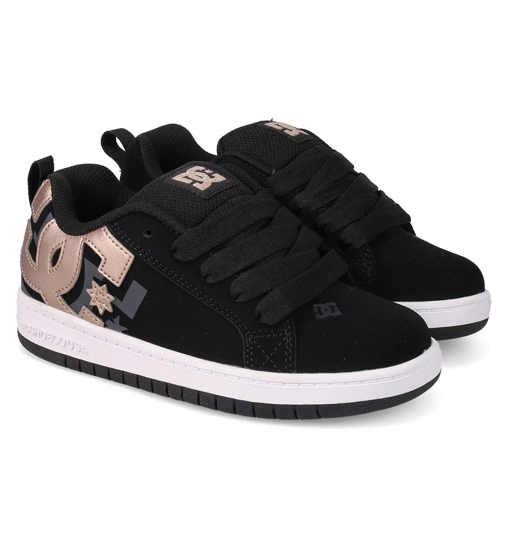 A pair of Kids' Court Graffik Shoes by DC Shoes with a classic puffy silhouette, thick black laces, white midsoles, and metallic bronze DC logos on the sides and tongue, displayed side by side on a white background.