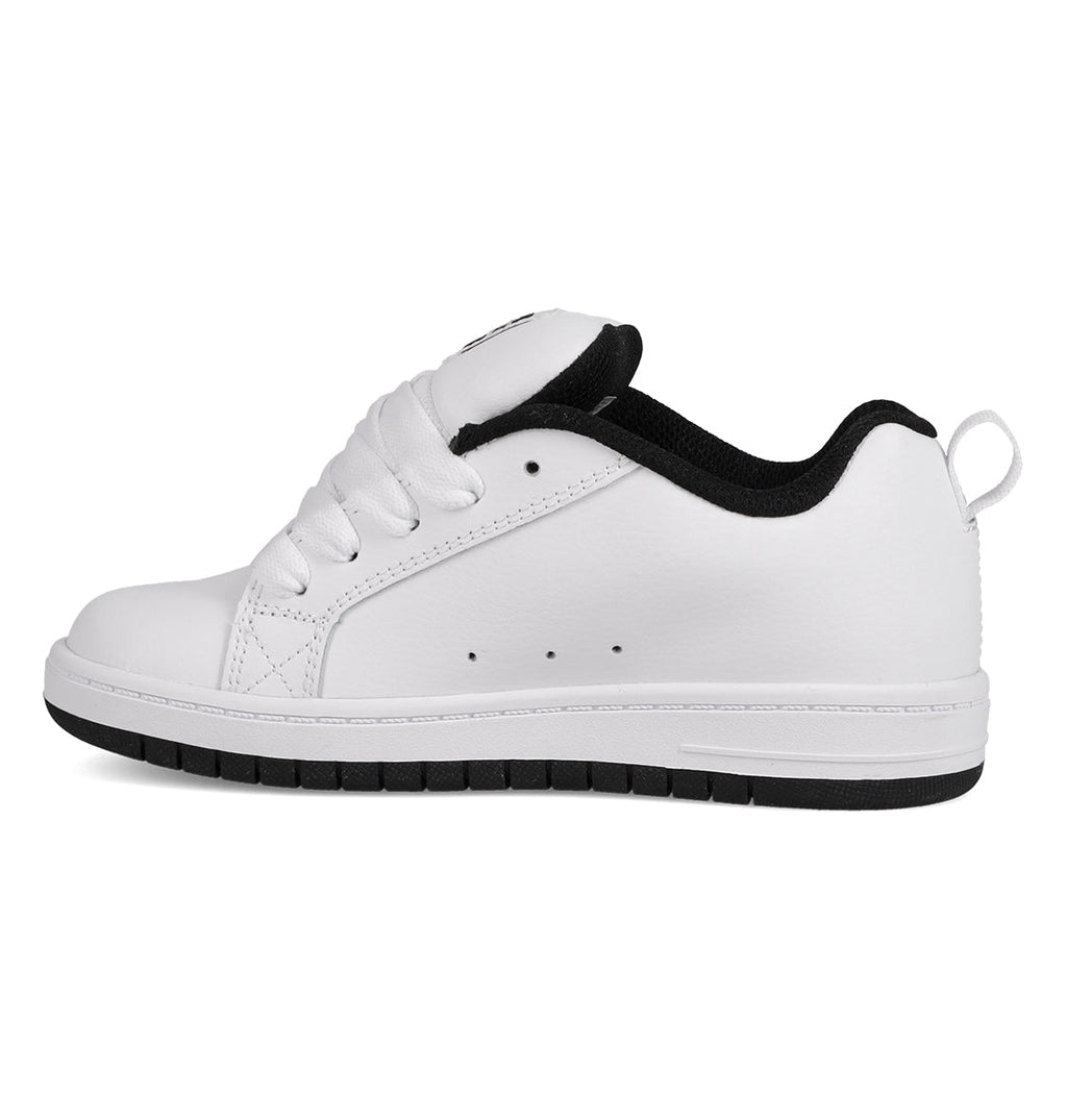 The Kids' Court Graffik Shoes by DC Shoes feature a white, skate-inspired design with black interior lining, white laces, a white sole with a black bottom edge, and heel pull tab—shown in side profile, perfect for kids' collections.