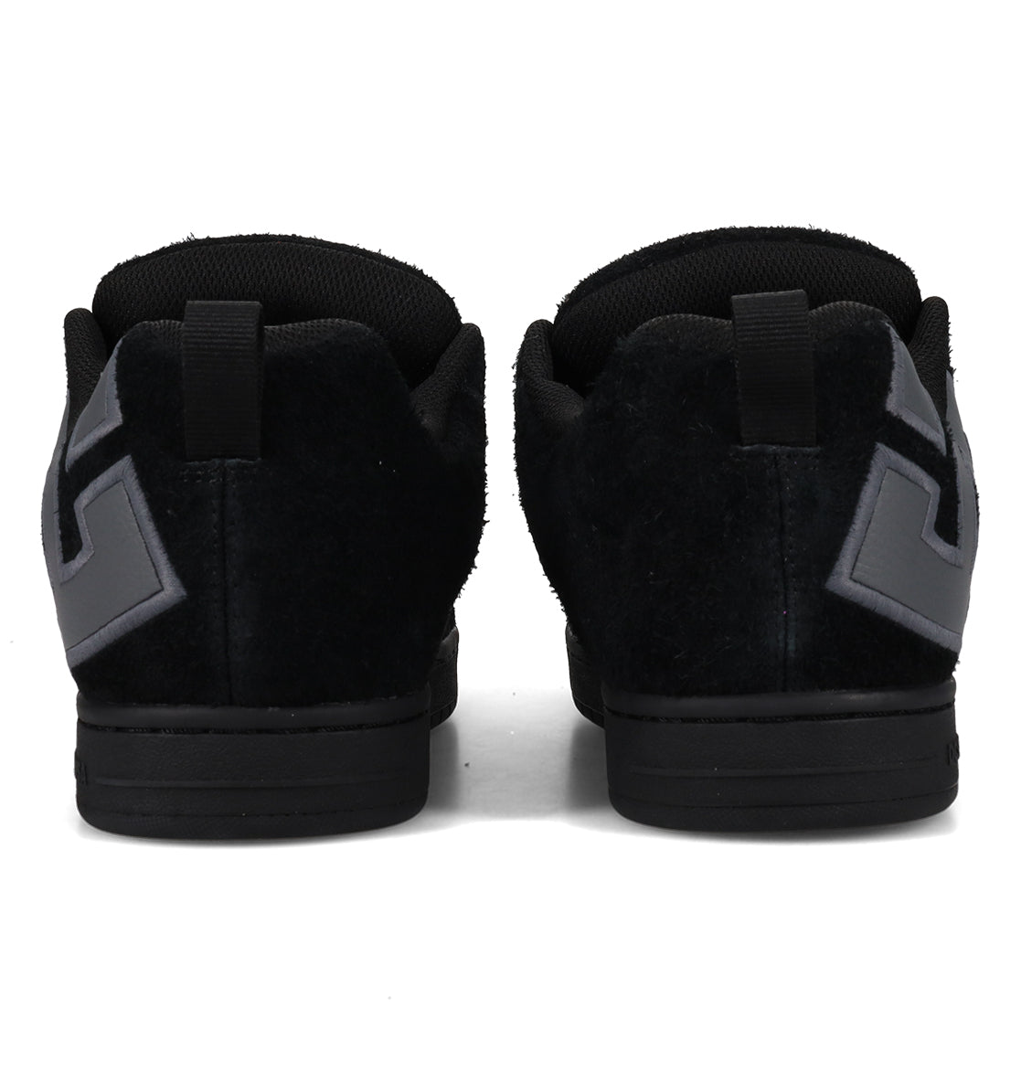 Back view of the DC Shoes Men’s Court Graffik Special Edition Shoes in black, featuring gray geometric designs on the heels, a two-tone sole, puffy silhouette, and pull tabs at the top of the heel.