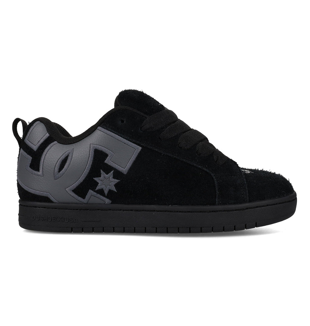 The Men’s Court Graffik Special Edition Shoes by DC Shoes feature a classic puffy silhouette in black, with thick black laces, a durable black rubber sole, and a gray DC Shoes logo on the side. Crafted from premium suede or nubuck-like material, these standout men’s skate shoes offer signature style and comfort.