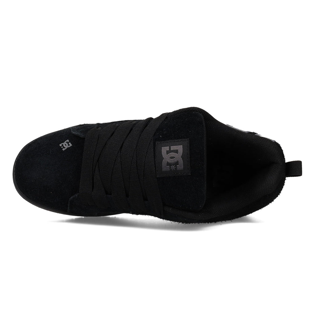 Top-down view of a black DC Shoes Men’s Court Graffik Special Edition skate sneaker featuring a puffy silhouette, black laces, suede upper, DC logo on the tongue patch and toe cap, and a two-tone sole, set against a white background.