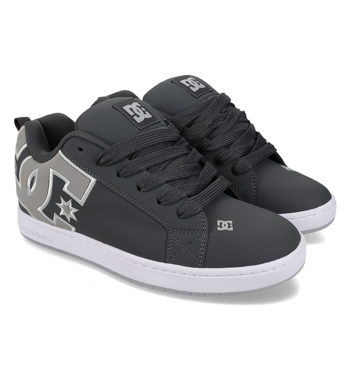 A pair of Men’s Court Graffik Special Edition Shoes by DC Shoes in a dark gray colorway, featuring a puffy silhouette, prominent white DC logos on the sides, black laces, and white rubber soles. The shoes are positioned side by side and angled slightly to the right.