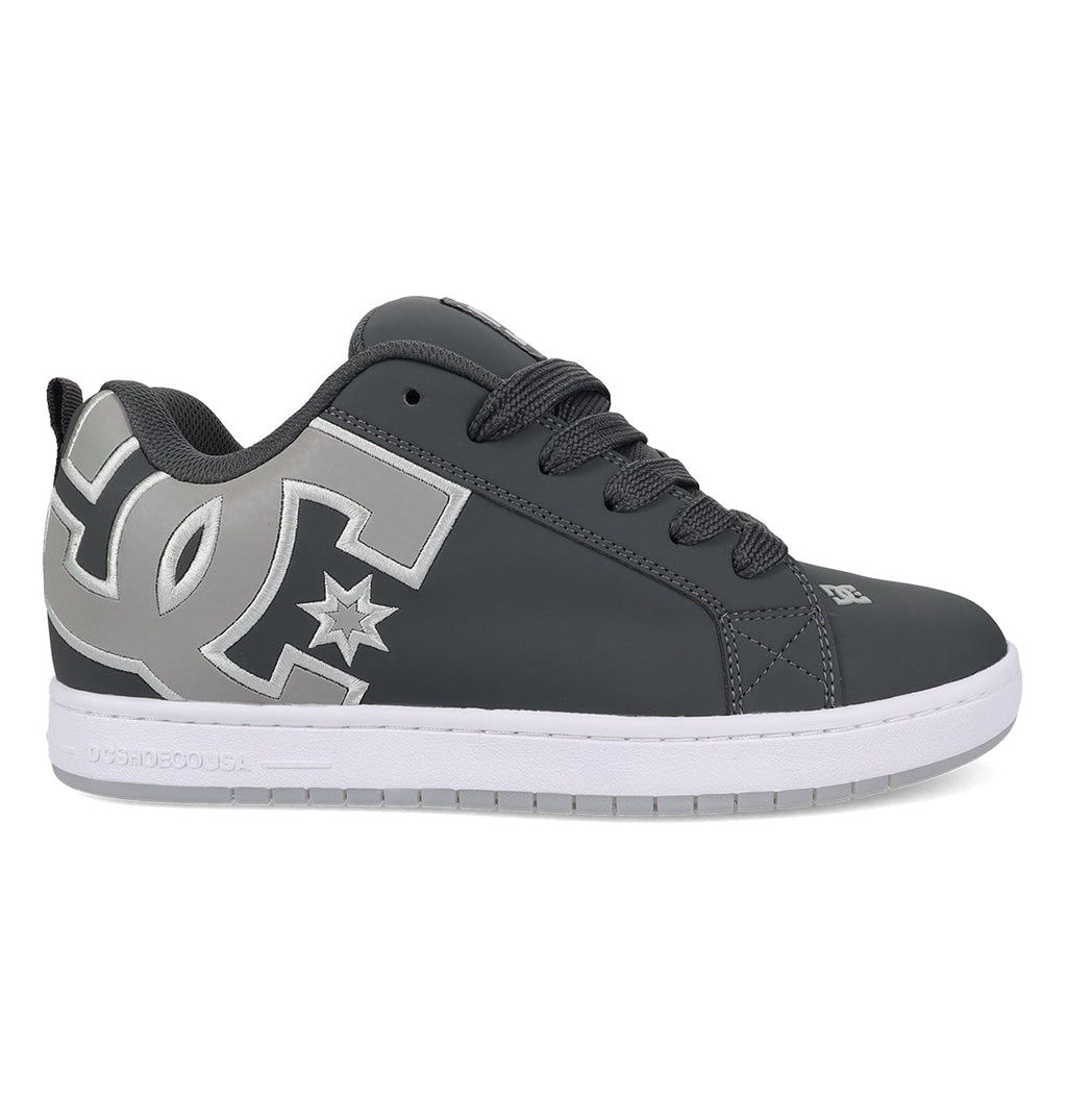 The Men’s Court Graffik Special Edition Shoes from DC Shoes feature a dark gray upper with black laces, a white sole, and a prominent light gray DC logo with a star on the side, showcasing the signature puffy silhouette of the iconic Court Graffik design.