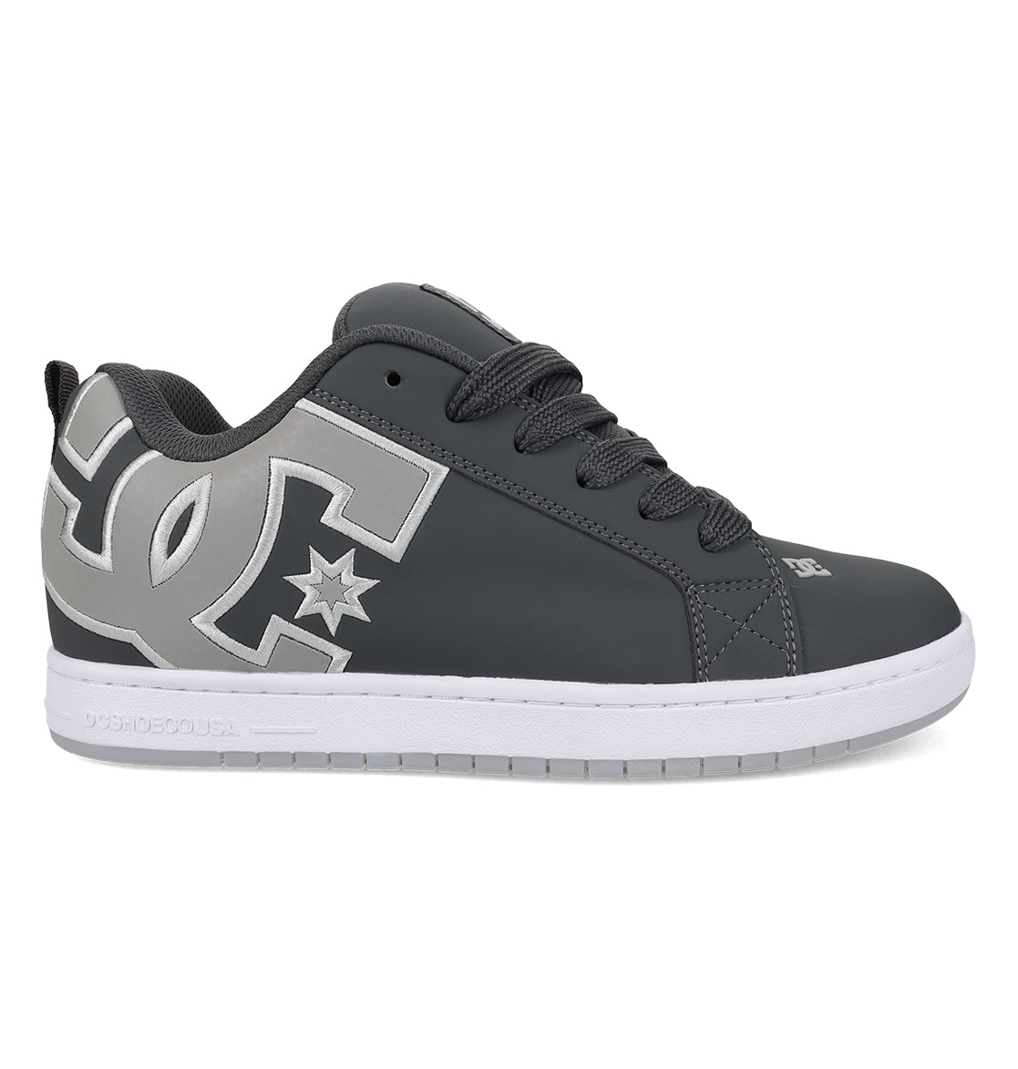 The Men’s Court Graffik Special Edition Shoes from DC Shoes feature a dark gray upper with black laces, a white sole, and a prominent light gray DC logo with a star on the side, showcasing the signature puffy silhouette of the iconic Court Graffik design.