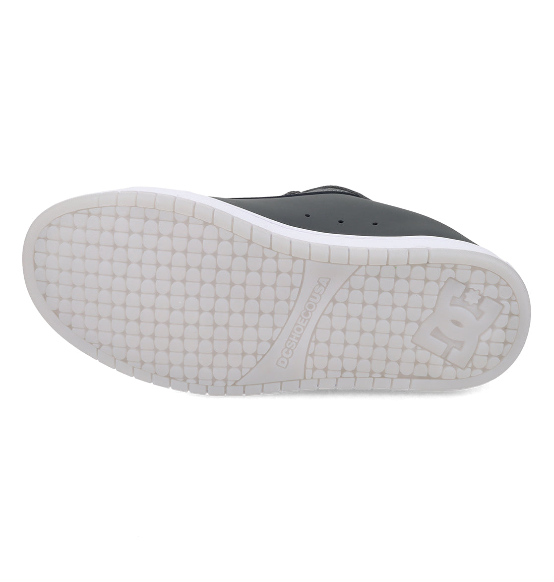 The image displays the white rubber sole of the DC Shoes Men’s Court Graffik Special Edition Shoes, featuring a textured tread pattern and the signature DC logo embossed near the heel—a distinctive detail characteristic of this model’s puffy silhouette.