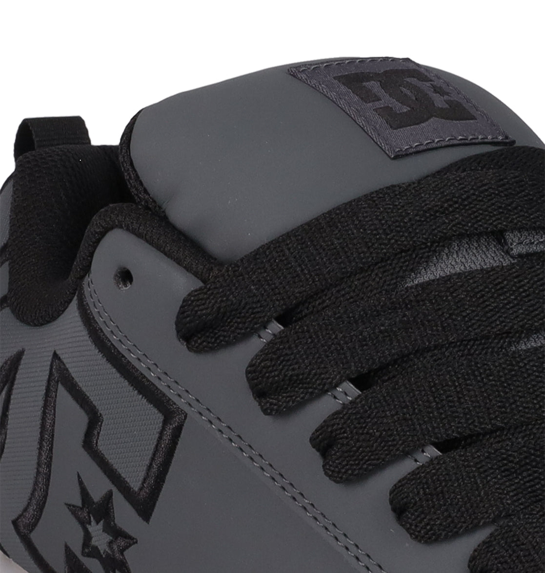 Close-up of the DC Shoes Men's Court Graffik SE sneaker in gray with black laces, a visible logo on the side and tongue, premium uppers, black trim, and a puffy silhouette for an on-trend style.