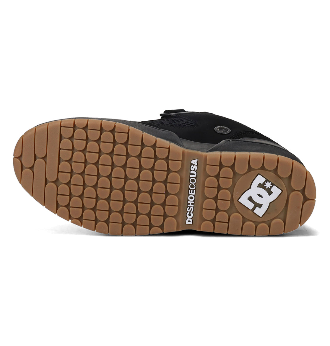 Black shoe sole with brown tread pattern on a white background