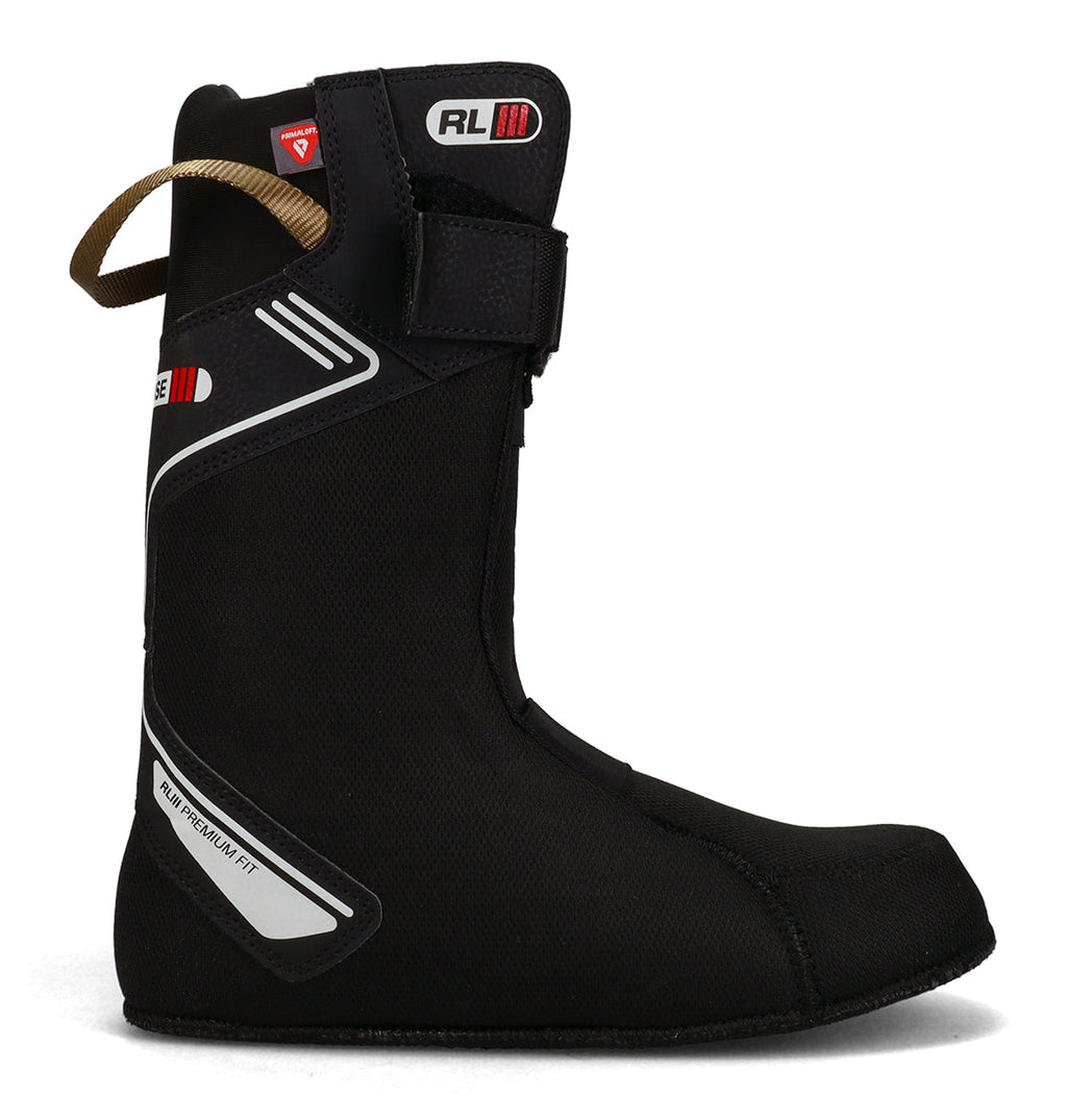 A side profile view of the DC Shoes Men’s Judge Snowboard Boots is displayed on a white background, showcasing a black liner with white and red accents and a brown pull strap at the back.