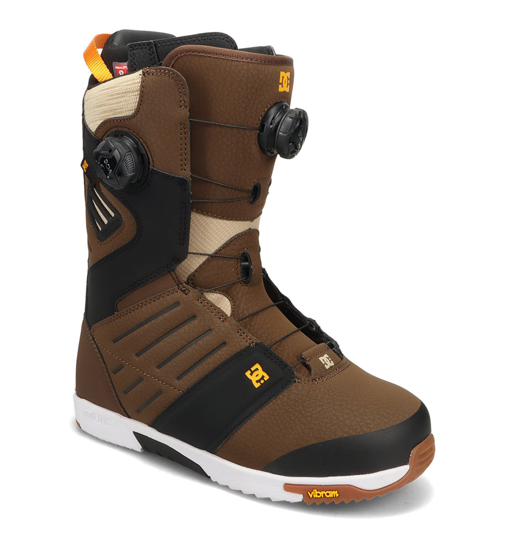 Introducing the DC Shoes Men’s Judge Snowboard Boots: these durable boots feature a brown and black colorway with a white Vibram sole, yellow accents, and dual circular BOA dials for optimal tightening. Designed with advanced support, reinforced padding, and distinctive Vibram branding on the sole, they’re the perfect choice for demanding riders.