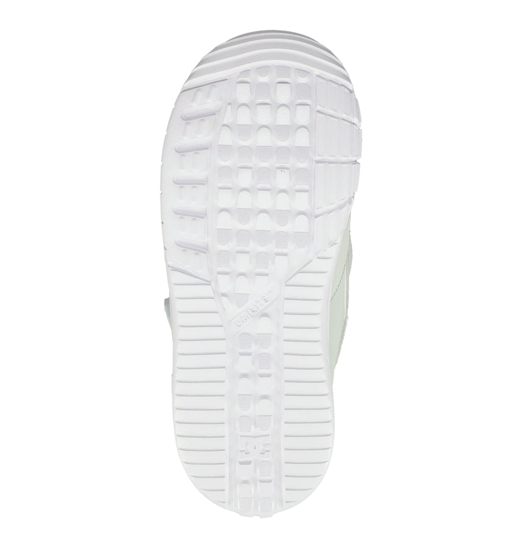 The sole of the DC Shoes Women’s Lotus Snowboard Boots is shown from below, featuring a white rubber outsole with a textured tread pattern composed of rectangular grooves and horizontal lines for superior grip. This design enhances comfort and support—qualities vital in Women’s Snowboard Boots—presented against a plain white background.