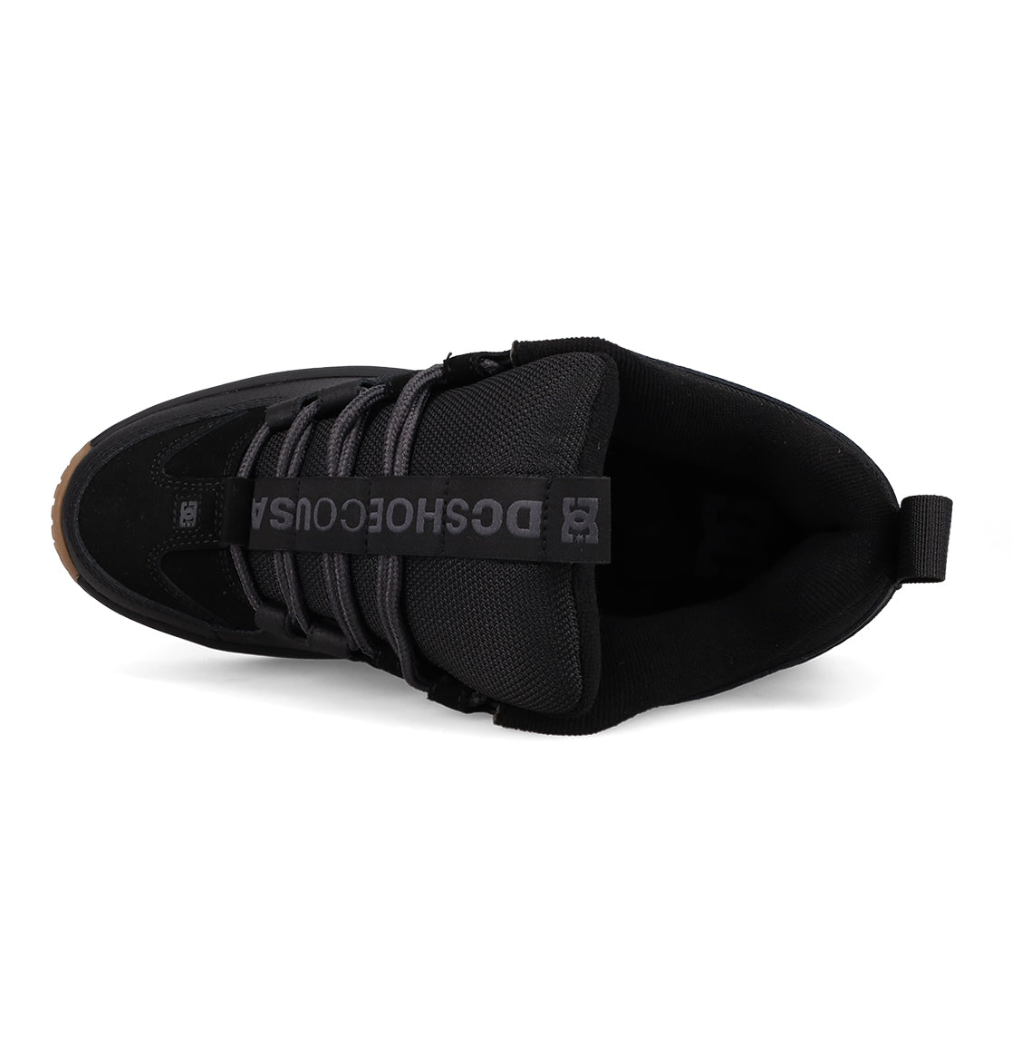 Top view of the Men's Lynx OG Shoes by DC Shoes, a skateboarding favorite with black laces, a black tongue with gray DCSHOECOUSA lettering, heel pull tab, and brown rubber sole at the toe.