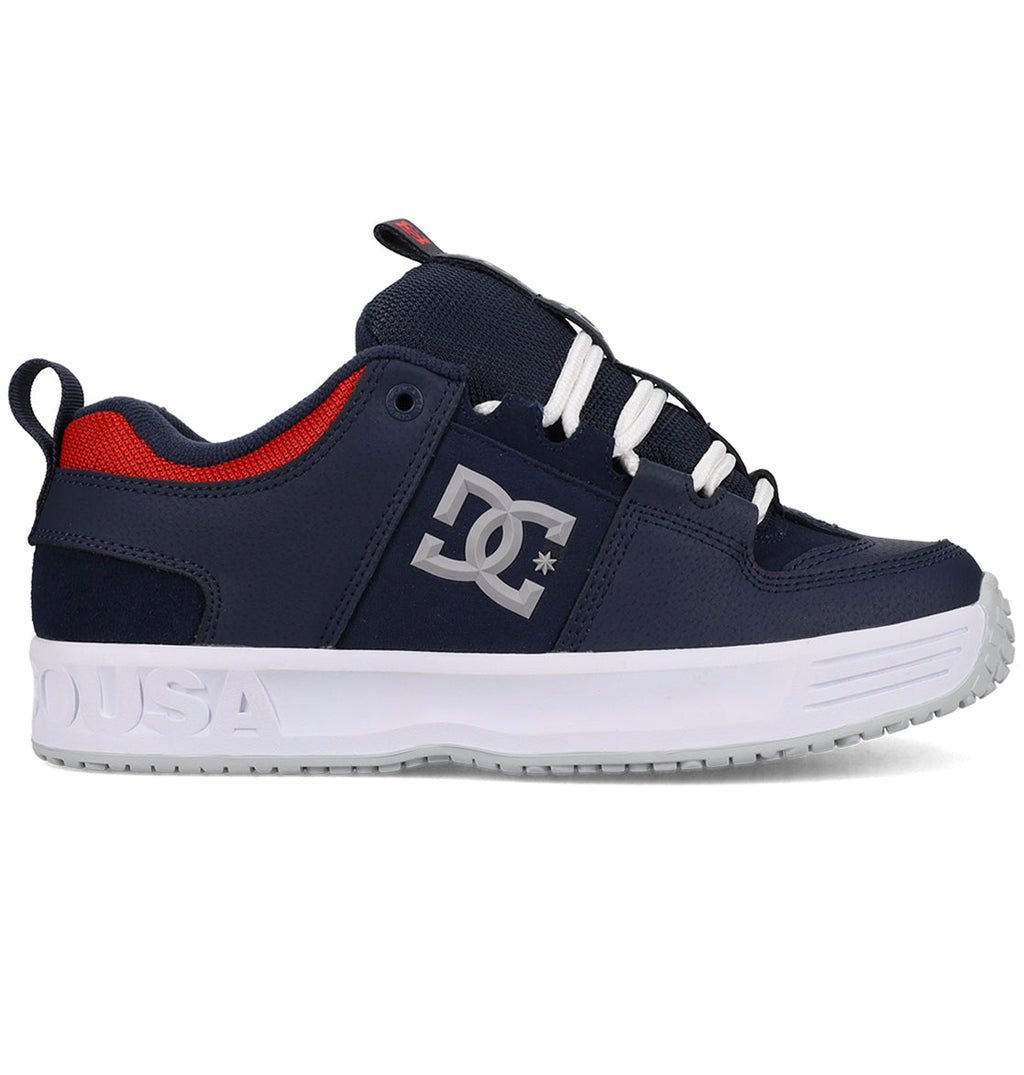 Navy blue and red sneaker with white sole on a white background