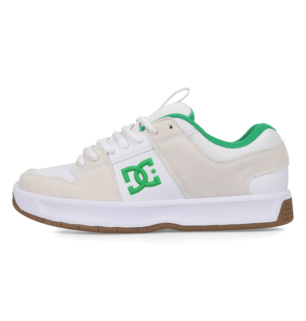 The DC Shoes Men’s Lynx Shoes in white and beige showcase green accents, such as the signature DC logo, green lining, white laces, and a white sole with a brown rubber bottom. This classic skate shoe is displayed from a side view.