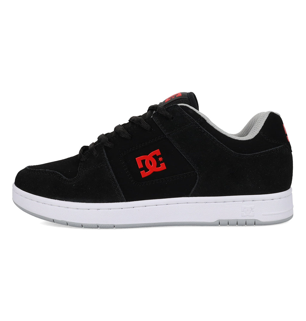 The Men’s Manteca 4 Shoes by DC Shoes feature a sleek black design with a white sole, highlighted by the signature red DC logo on the side and tongue, complemented by black laces—crafted for modern comfort and skate performance enthusiasts.