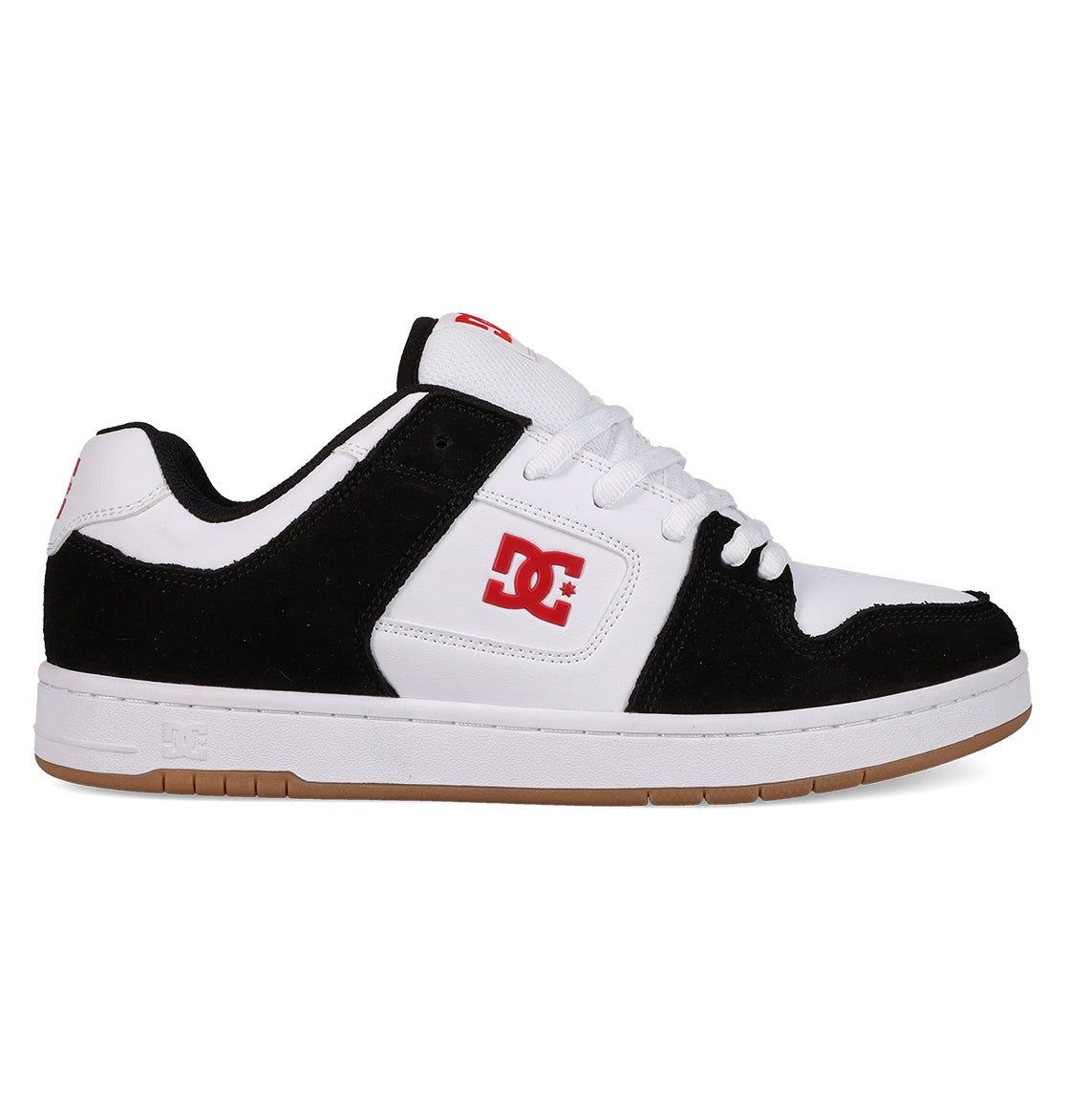 A black and white DC Shoes Men's Manteca 4 with a gum sole, white laces, red DC logo on side and tongue, plus suede accents. This low-cut sneaker offers classic style for skate or streetwear.