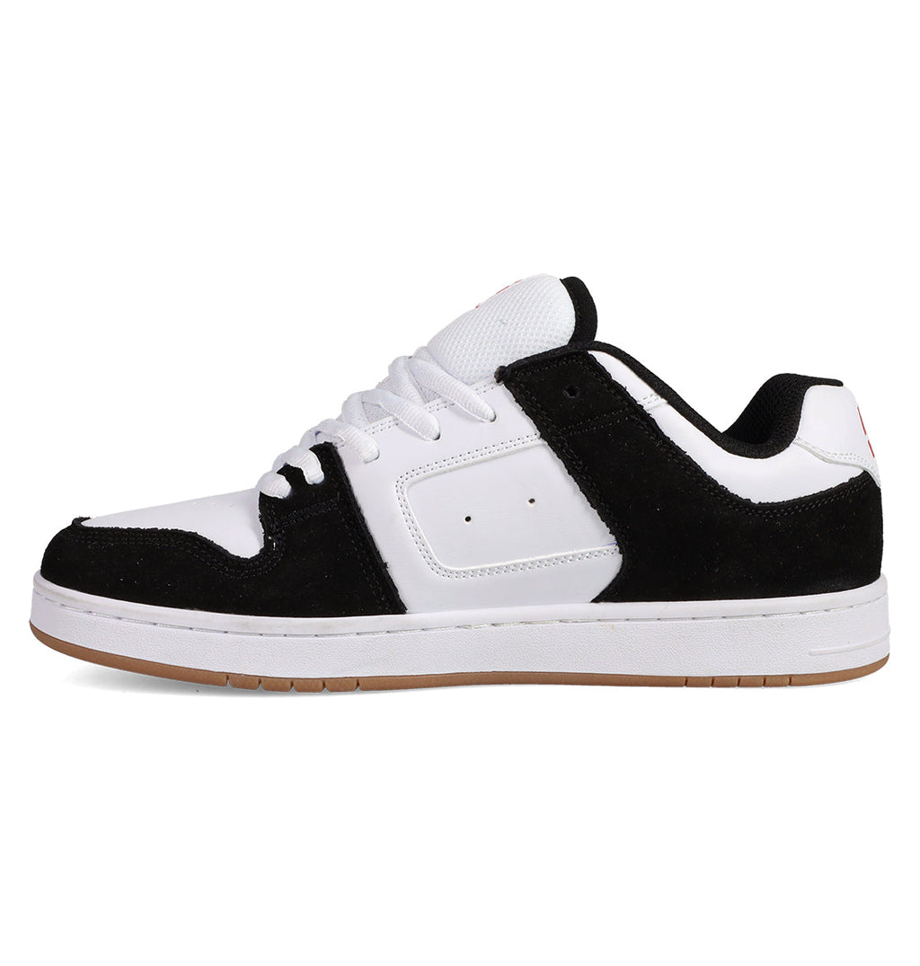 The Men's Manteca 4 Shoes by DC Shoes feature a low-top design with a white sole and upper, black suede overlays and lining, white laces, a gum-colored outsole, and perforations near the midfoot for classic style.