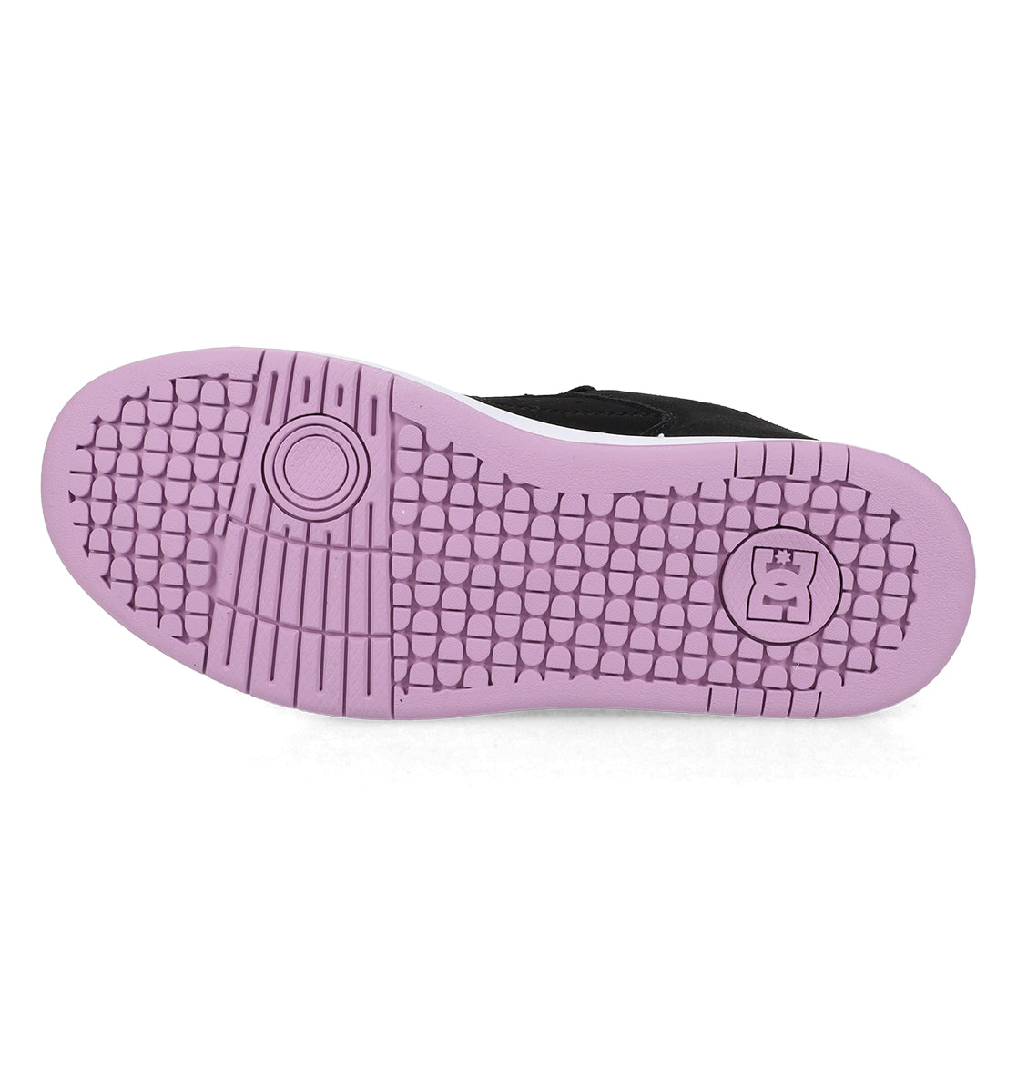 The image displays the sole of a black shoe featuring a pink, textured grip pattern and a raised DC logo near the heel, embodying the timeless design of DC Shoes’ Women’s Manteca 4 Shoes.